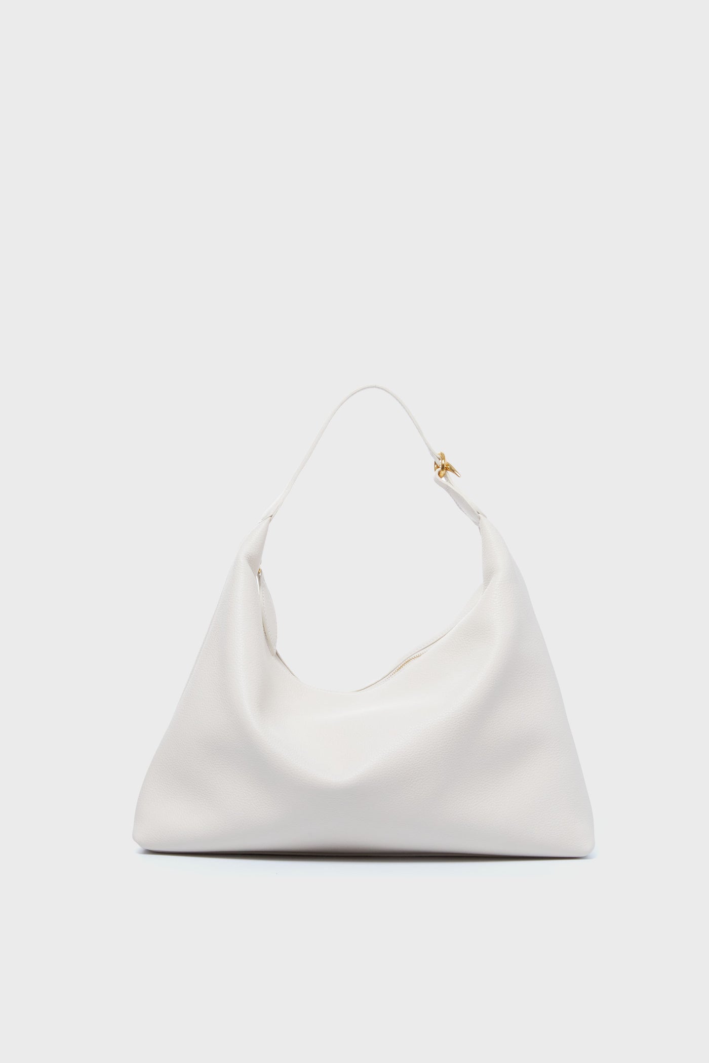The Liffner minimalist white calf leather shoulder bag features a soft, slouchy shape, single top handle, and small gold-tone hardware accent, all showcasing Italian craftsmanship.
