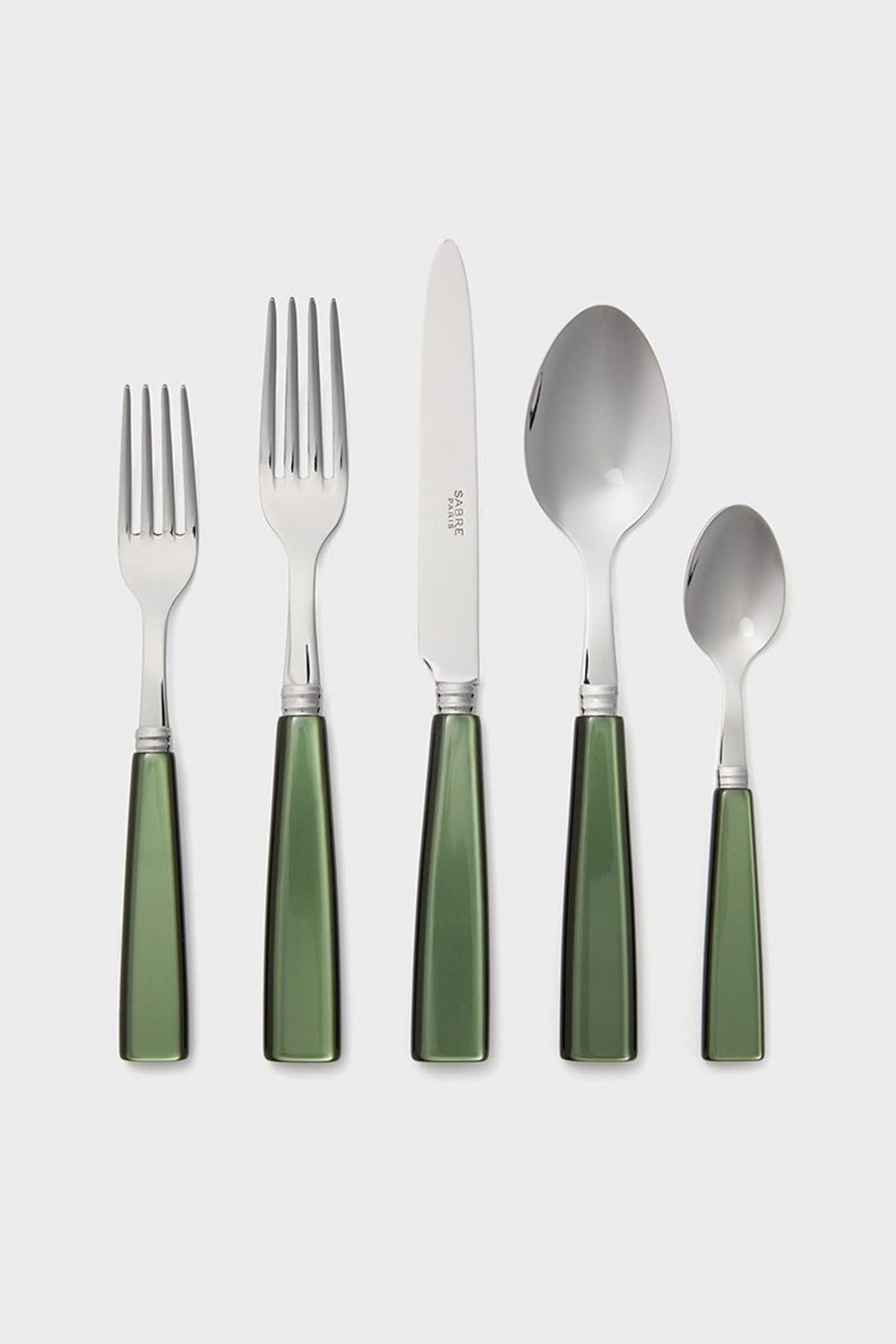 A set of five Sabre Paris tableware pieces—two forks, a knife, a spoon, and a teaspoon—with shiny green handles arranged in a row.