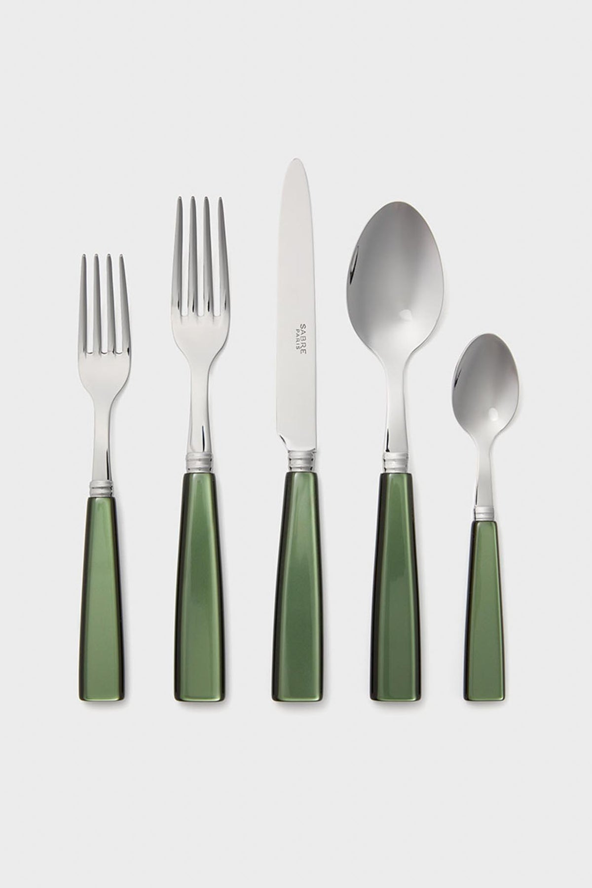 A set of five Sabre Paris tableware pieces—two forks, a knife, a spoon, and a teaspoon—with shiny green handles arranged in a row.