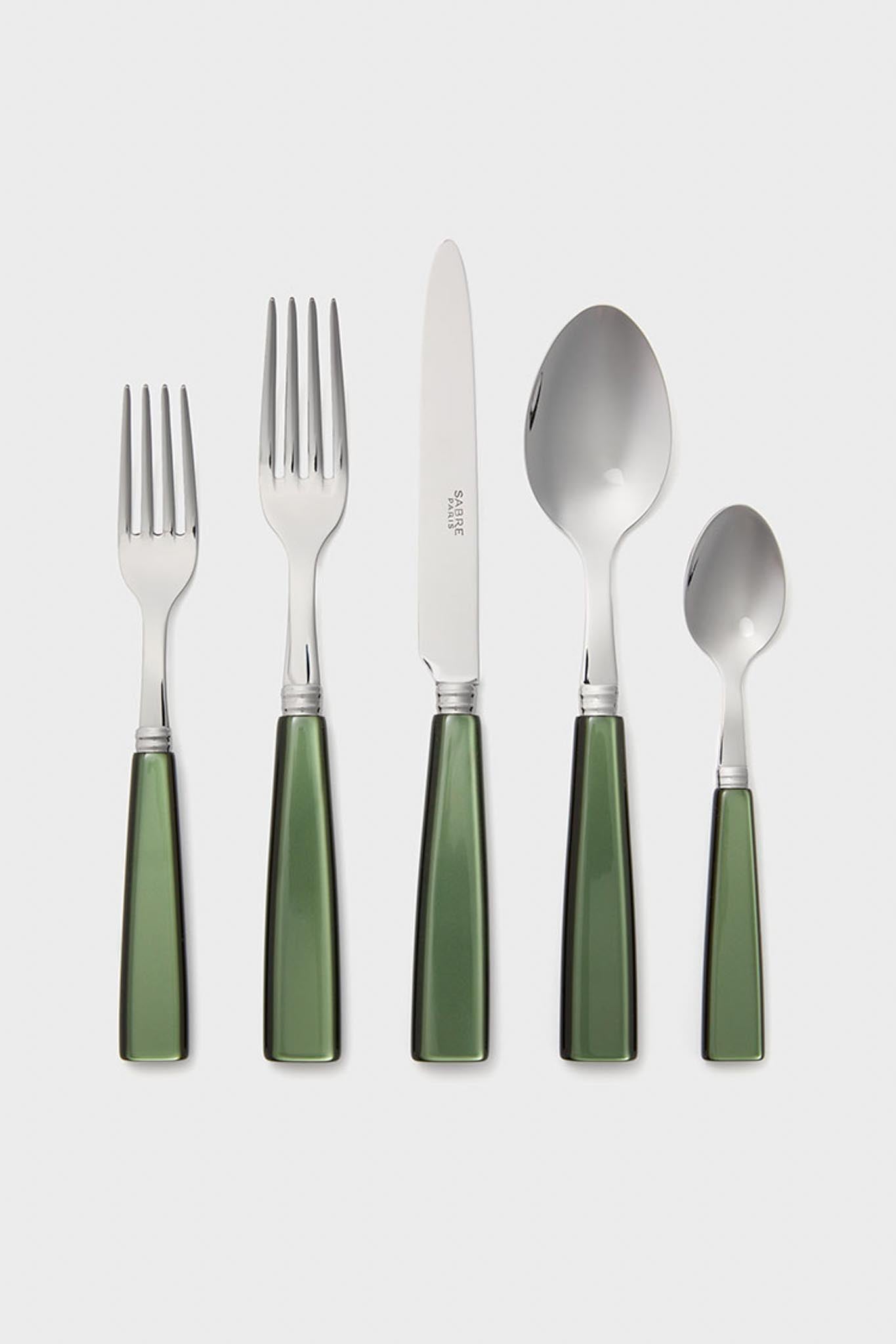 A set of five Sabre Paris tableware pieces—two forks, a knife, a spoon, and a teaspoon—with shiny green handles arranged in a row.