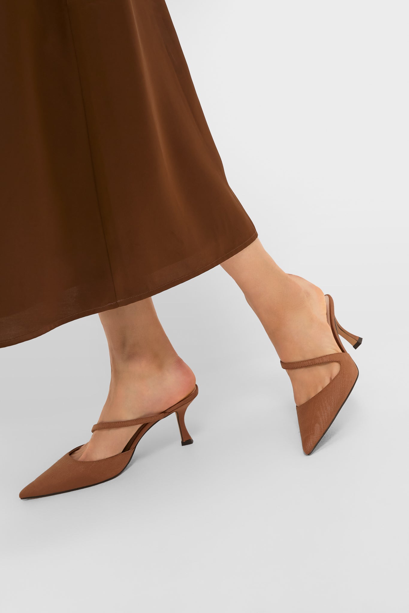 Chestnut Moire Mimi Heels: Classic, effortless slip-on mules with a mid-height kitten heel and instep strap, embodying high-end fun and confidence.