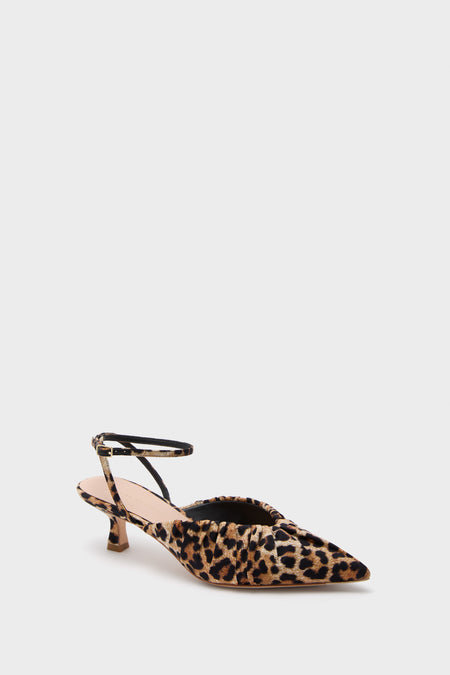 Loeffler Randall pointed-toe slingback kitten heels with a leopard print and thin ankle strap are shown on a white background.