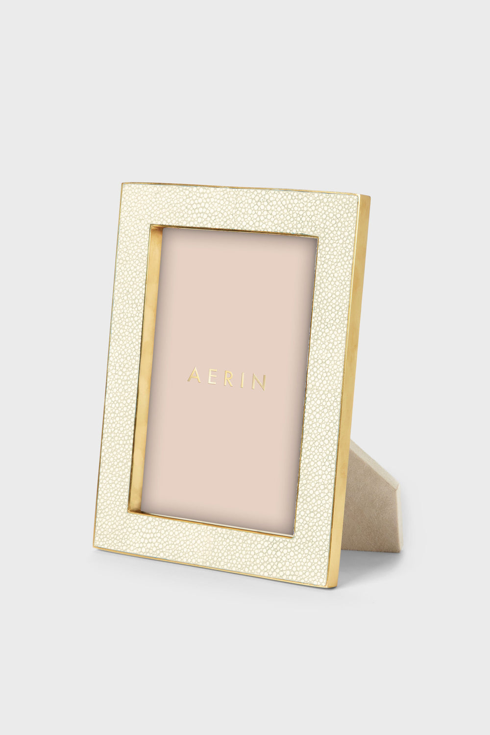 AERIN gold and cream embossed shagreen rectangular photo frame with stand, featuring a placeholder and offering an elegant luxury accent for your home decor.