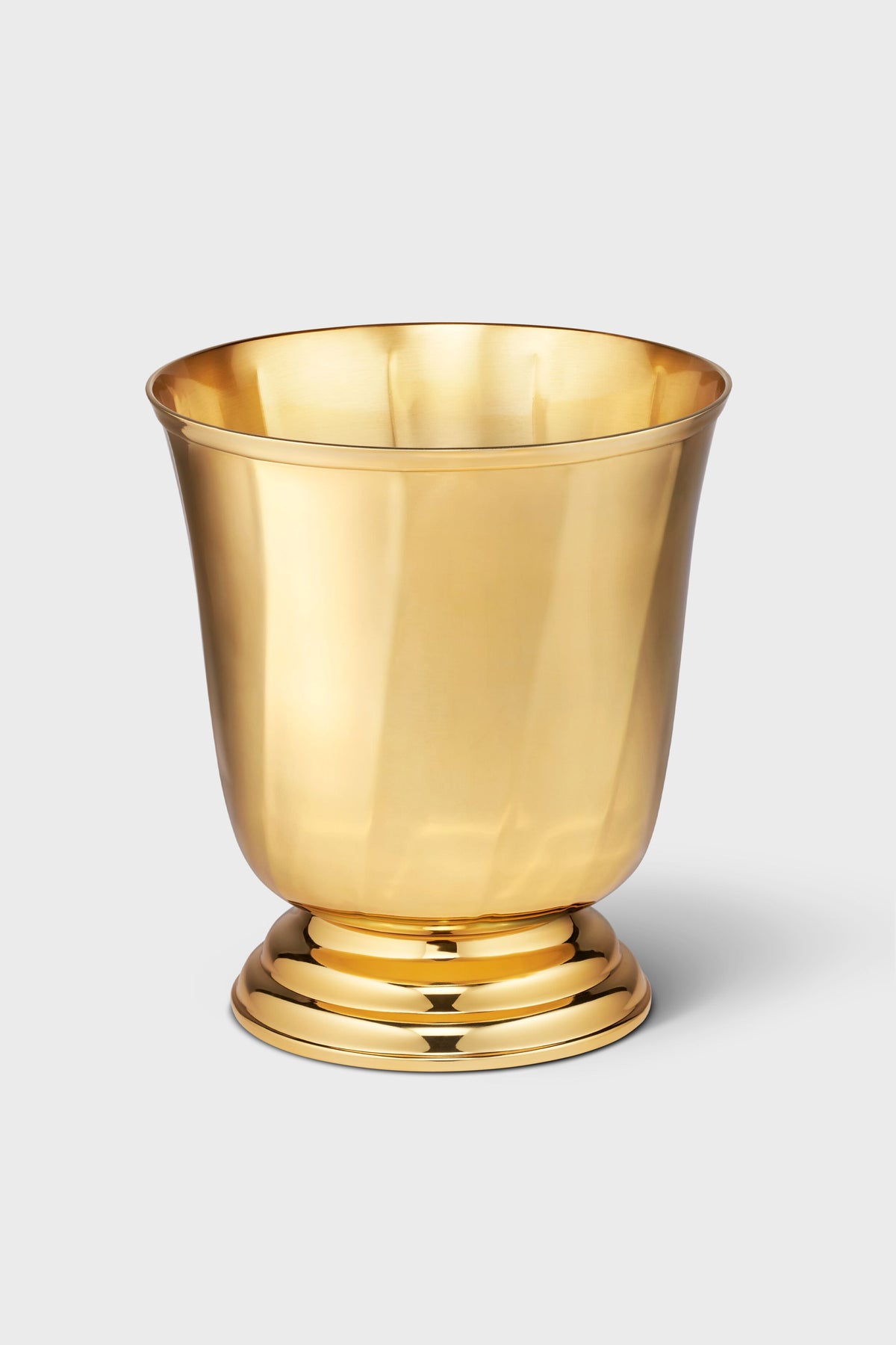 The AERIN shiny gold-colored stainless steel bowl features a wide rim and round base, making it perfect as an ice bucket for your home bar.
