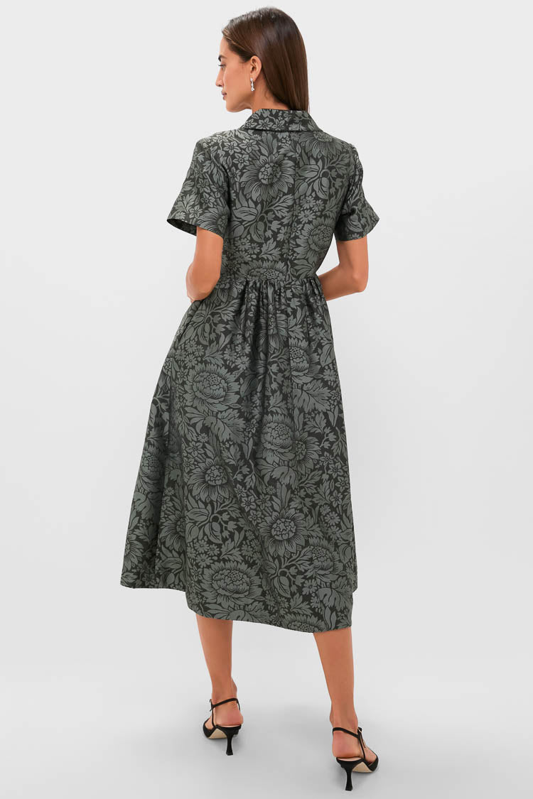 Model in the classic, high-end Emerald Mirasol Jacquard Adelaide Dress with a chic silhouette, gathered skirt, and effortless botanical print, exuding fun and elegance.
