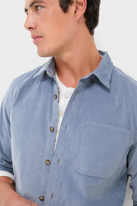 Effortlessly cool, the Maritime Wilder Stretch Corduroy Shirt is modeled open over a white henley, showcasing its classic, versatile design with a single chest pocket.