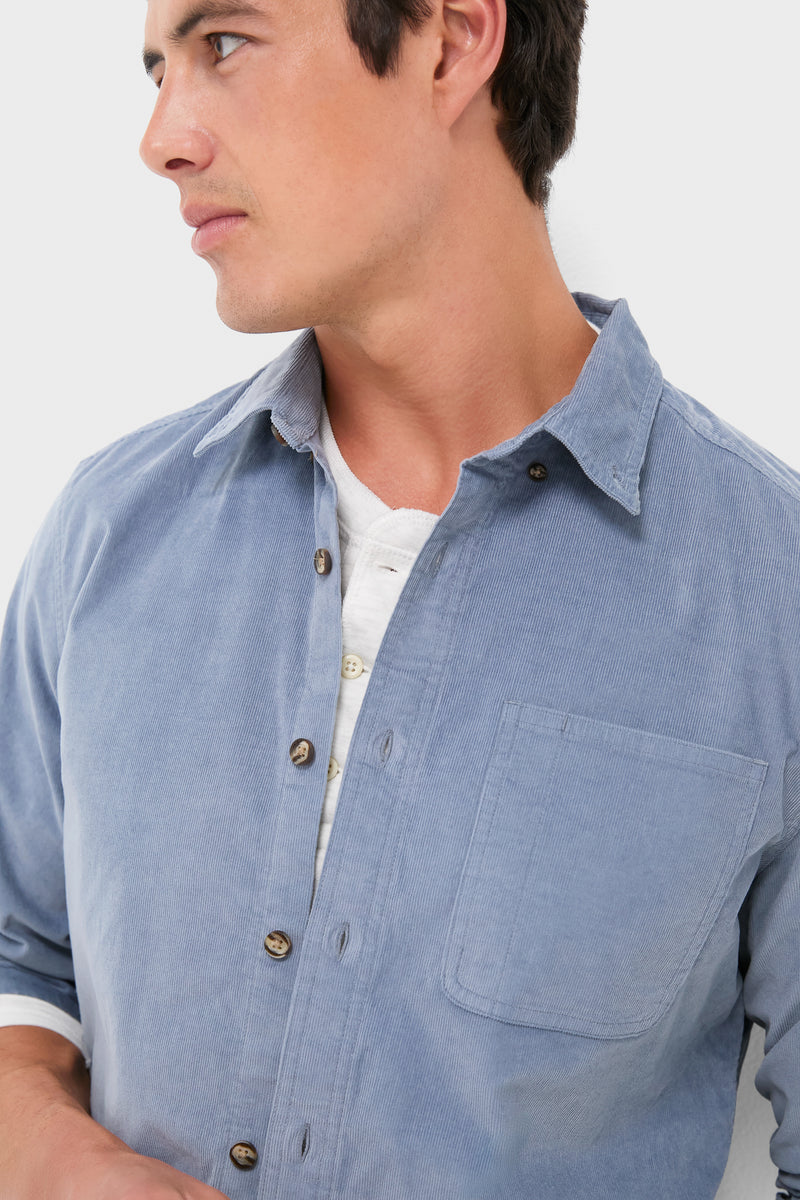 Effortlessly cool, the Maritime Wilder Stretch Corduroy Shirt is modeled open over a white henley, showcasing its classic, versatile design with a single chest pocket.