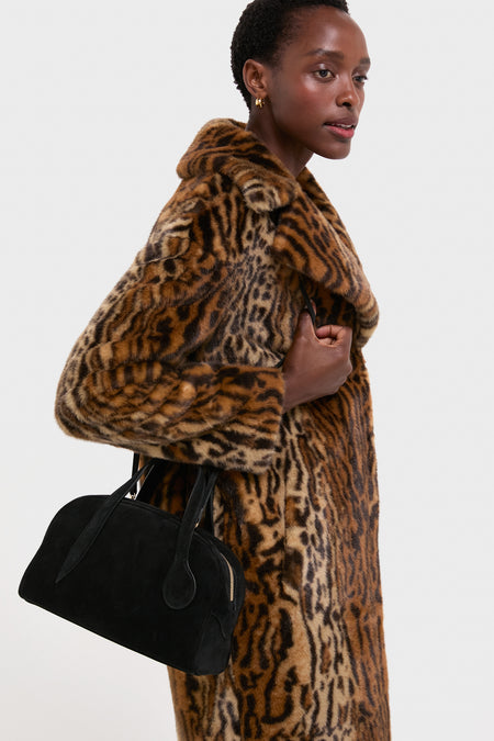 A classic look: Black Suede Mini Bowling Bag with signature handles, exuding effortless style; perfect for fun, high-end outings.