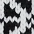 Close-up of a black and white houndstooth patterned textile, highlighting its intricate design.