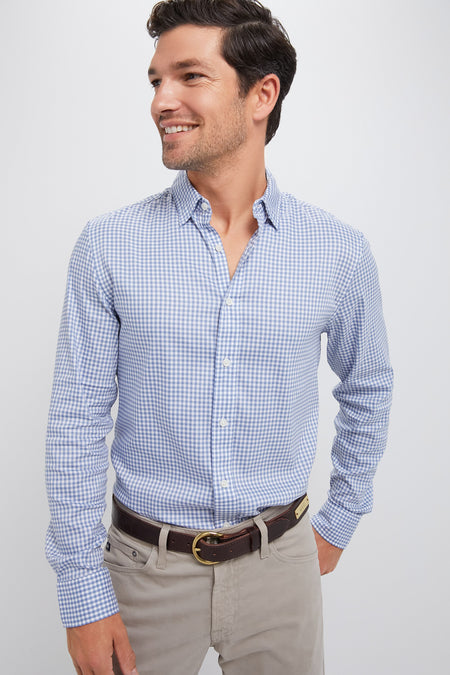 Model in classic Light Blue Gingham Movement Shirt, effortlessly styled with khaki trousers and a dark brown belt, exuding fun and high-end surf culture-inspired fashion.
