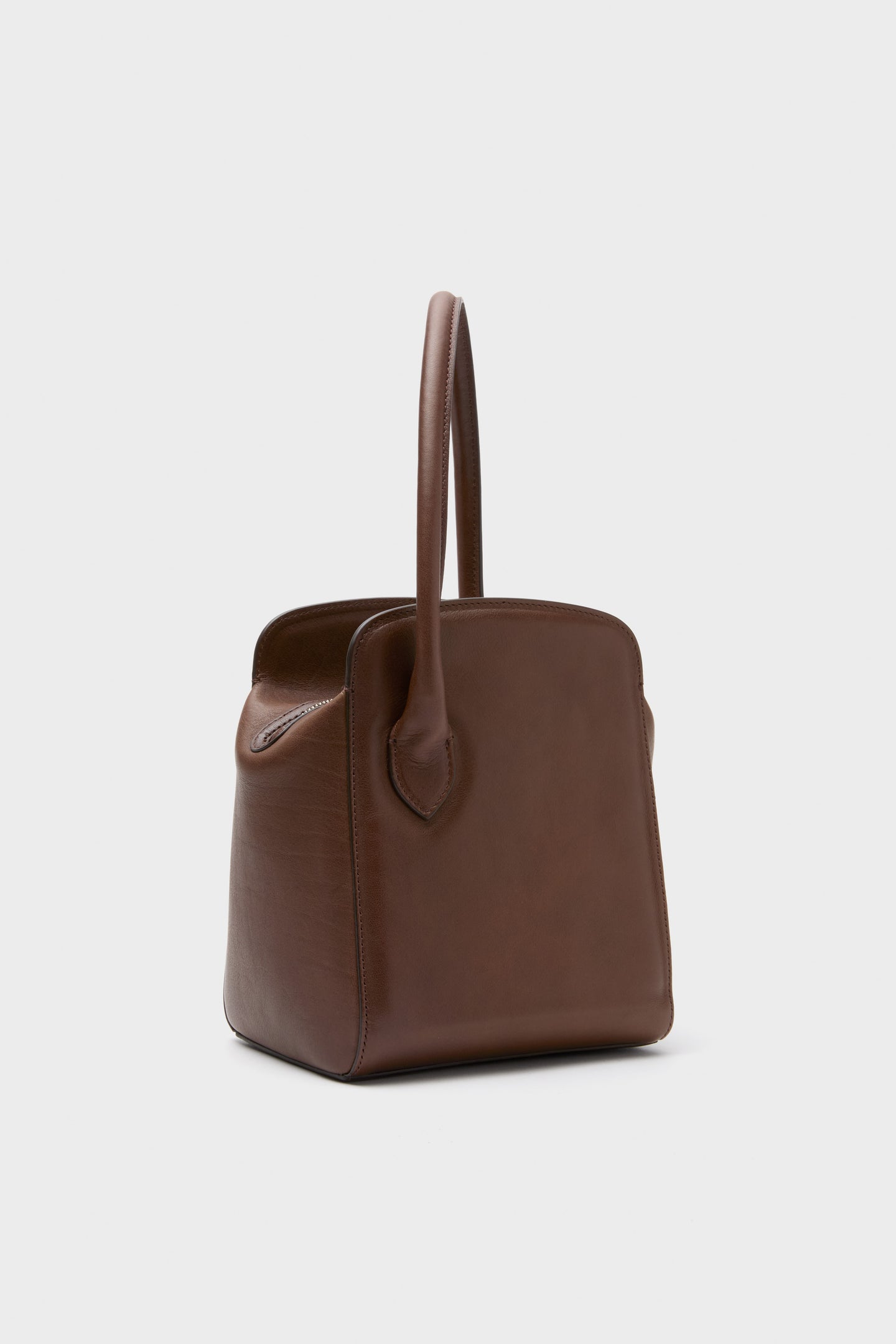 Dark Brown Leather Sporty Lady Bag with a classic, sculptural silhouette, effortless top handle, and fun charm; a high-end, versatile accessory for any occasion.