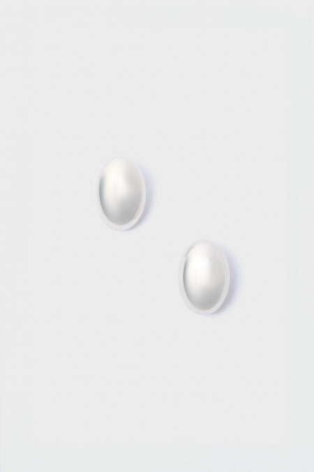 A pair of round white pearl stud earrings from Lie Studio, crafted in 18-carat gold-plated sterling silver.