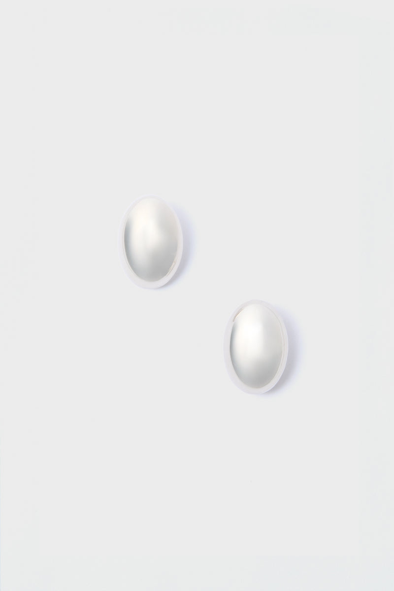 A pair of round white pearl stud earrings from Lie Studio, crafted in 18-carat gold-plated sterling silver.