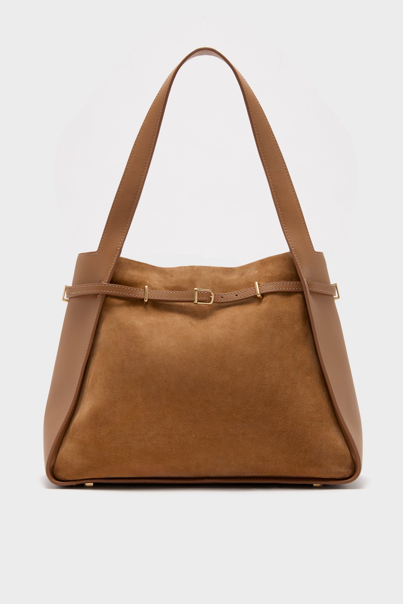 The SIMKHAI tote is crafted from brown leather and calf suede, featuring wide shoulder straps and a decorative belt detail across the front.