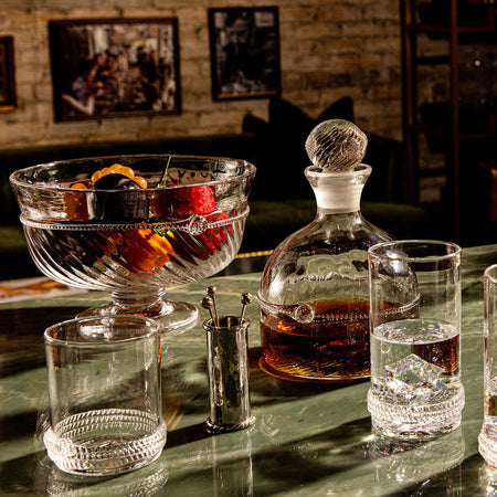 Effortless elegance with the Amalia 10 Footed Bowl, a classic high-end glass centerpiece showcasing fruit, embodying fun sophistication and artisanal craftsmanship.