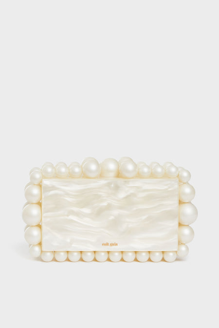 A rectangular box clutch by Cult Gaia, featuring a pearlescent finish and accented with large and small acrylic pearl beads.