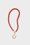 A HART carnelian necklace featuring small red beads and an 18K gold-plated horseshoe charm.
