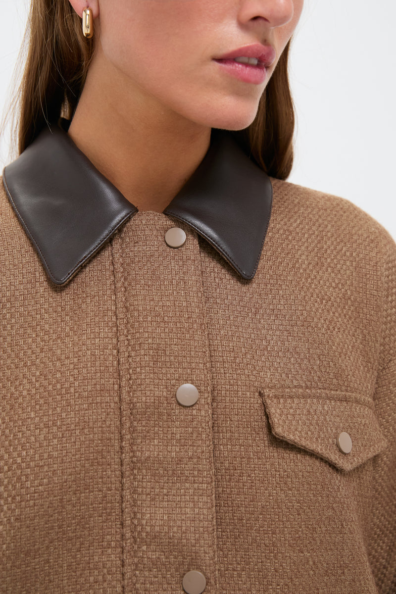 Woman wearing the Brown Bourbon Jacket with a faux leather collar and snap-flap pocket, showcasing its classic, effortless style and high-end textured fabric.