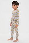 Young boy in classic, effortless Tigers Kids Bamboo Pj Set, featuring fun tiger prints on a light-blue top and leggings. High-end, breathable bamboo fabric ensures comfort.