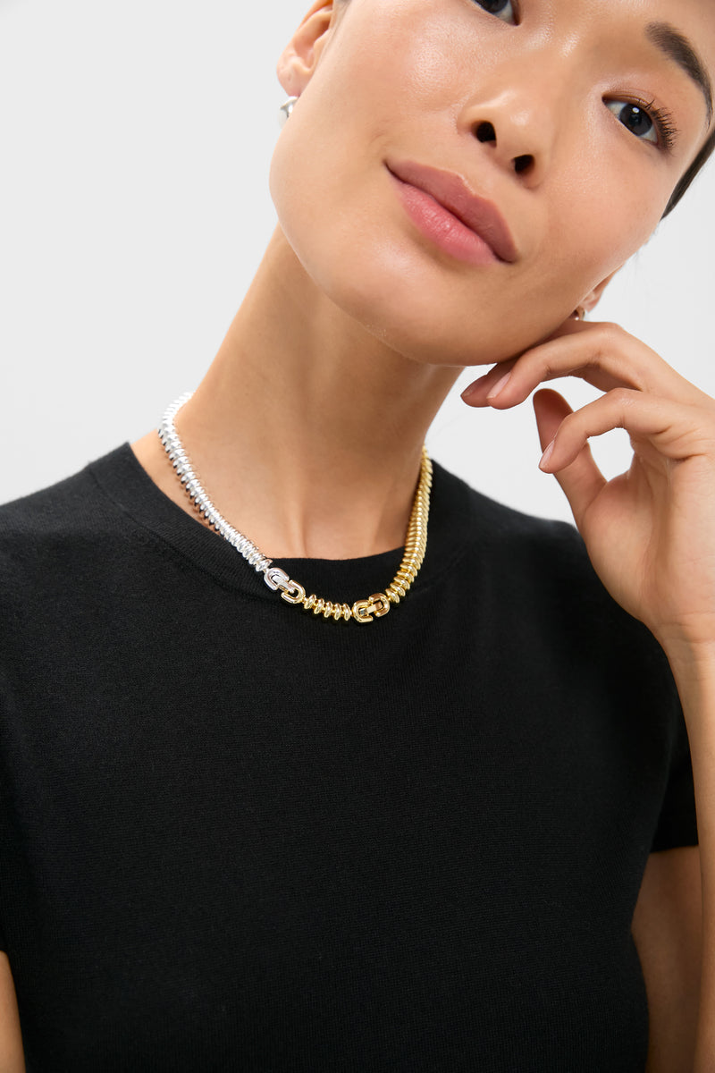 Woman wearing the Two-Tone Sofia Choker, a classic and high-end piece with a versatile ribbed design in silver and gold, effortlessly blending fun and elegance.