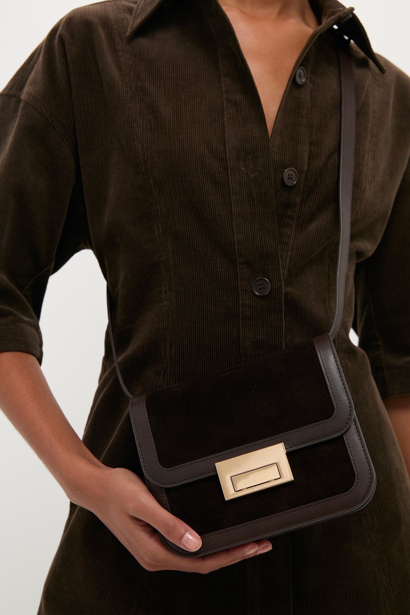 Tmoro Suede Desi Crossbody Bag; a classic, high-end accessory with an effortless design, featuring a flap top and gold-tone closure, perfect for fun, everyday use.