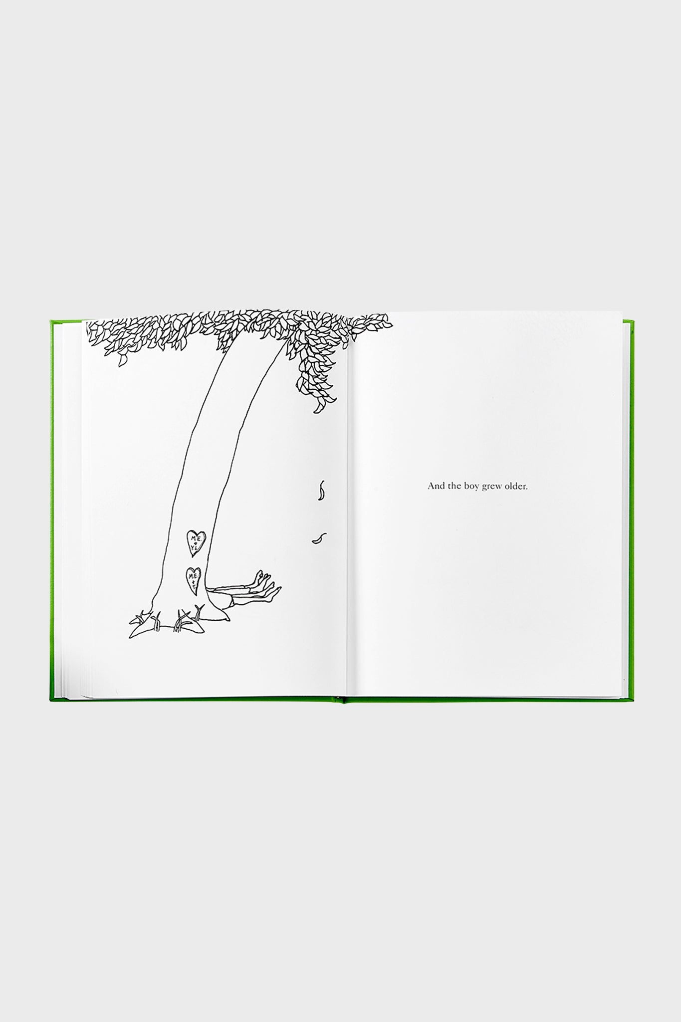 Classic children’s book, The Giving Tree, open to a line drawing of a tree and text, embodying effortless storytelling and high-end design. Fun, timeless reading for all ages.