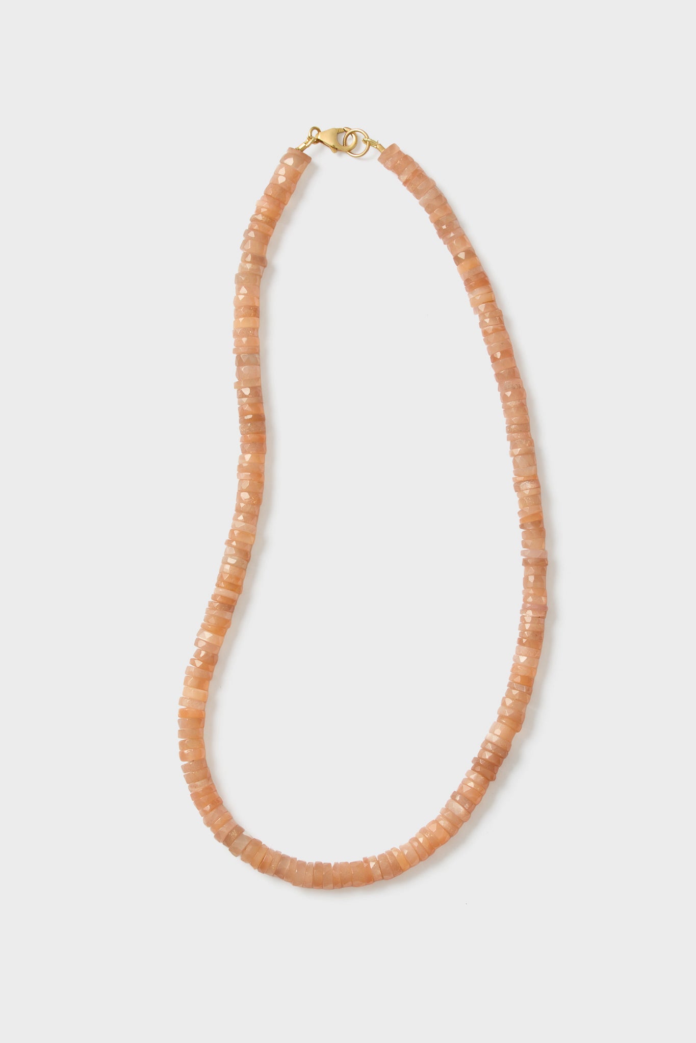 Theodosia circular peach beaded necklace features flat beads and a gold clasp, beautifully handcrafted as fine jewelry.