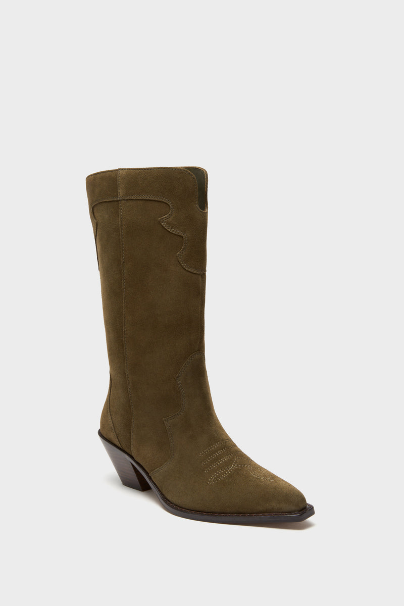 The Tuckernuck Shoes olive green suede Western boot features a pointed toe, decorative stitching, and a slanted block heel.