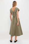 Woman in Burnt Olive Chino Solen Midi Dress showcasing the classic, effortless A-line silhouette with corset lace-up back, embodying a high-end, fun style.