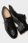 Black Leather Brogue Oxford Shoes featuring classic wingtip perforations, lace-up closure, and a block heel for an effortlessly cool and high-end look.
