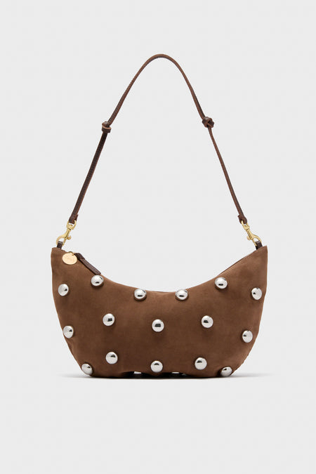Clare V brown Italian leather shoulder bag with a curved shape, adjustable strap, and front adorned with evenly spaced silver nickel studs.
