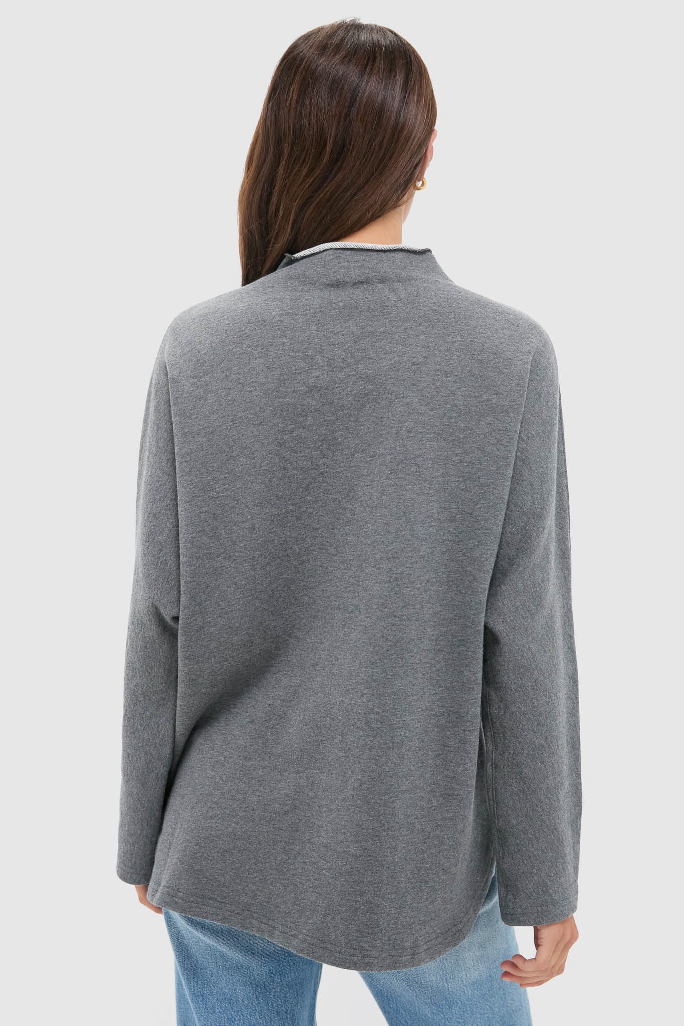 Model wearing the Slate Gray Bowie Popover, a classic, effortless pullover with batwing sleeves and a swing shape, perfect for fun, high-end casual styling.