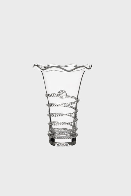 A clear spiral glass vase with a wavy rim, raised spiraling bands, and a circular accent on its body from Juliska.