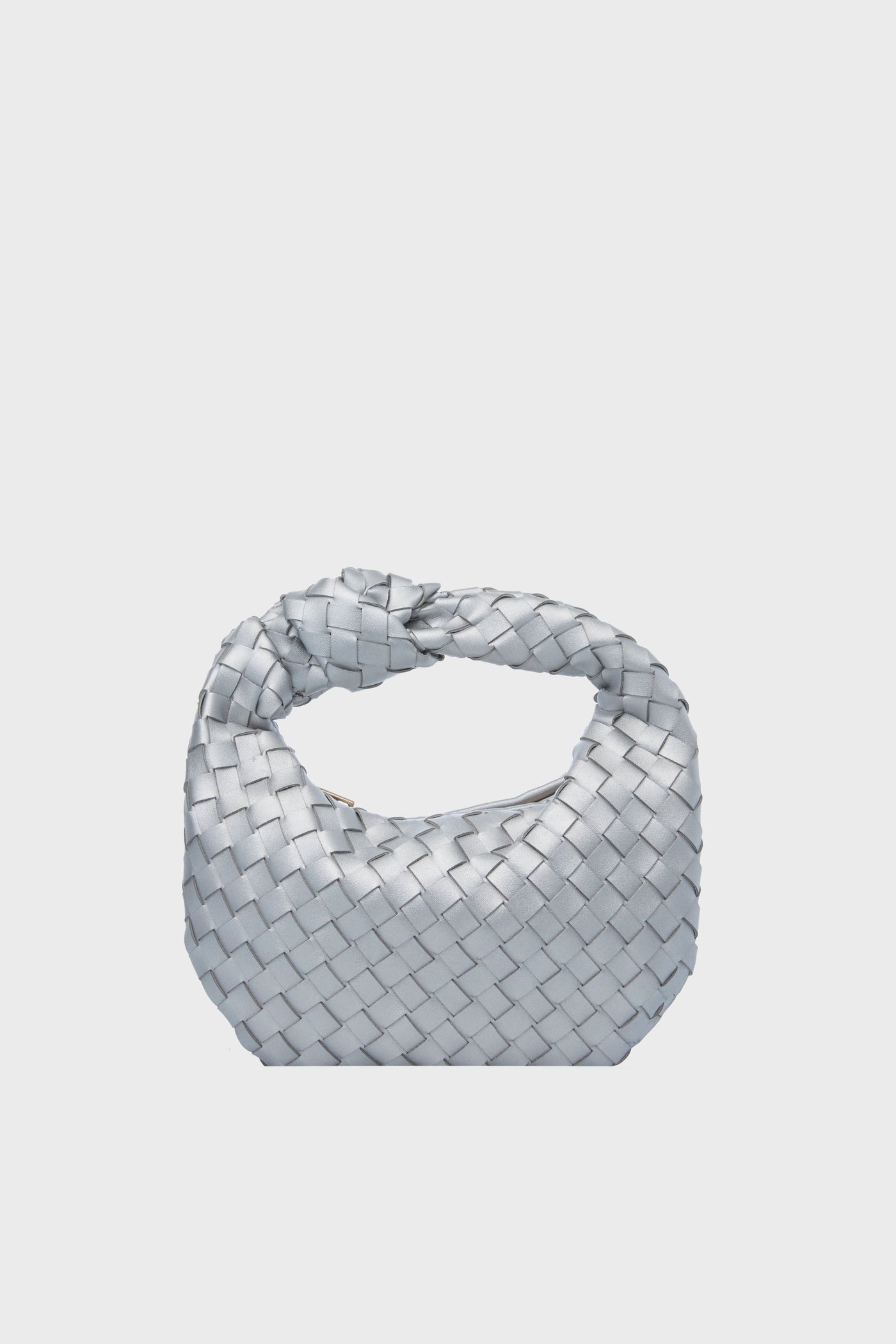 The Urban Expressions silver woven clutch features a knotted handle and an elegant animal-friendly handbag design.