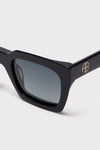 Black Indio Sunglasses feature classic square frames with gold accents, offering effortless, high-end style and fun versatility for everyday wear.