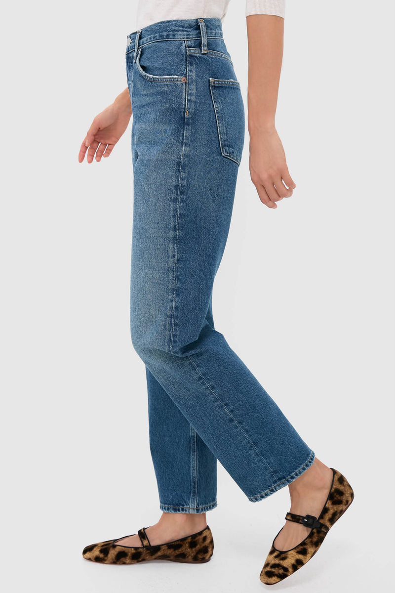 Bounty Mid Rise Loose Fit 90's Jean in classic denim, effortlessly paired with leopard-print Mary-Jane flats for a fun, high-end look, perfect for everyday style.