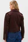 Woman wearing the Chocolate Faux Suede Bristol Jacket, showcasing a classic, effortless style with gold zipper details and chic shoulder tabs, paired with high-waisted jeans.