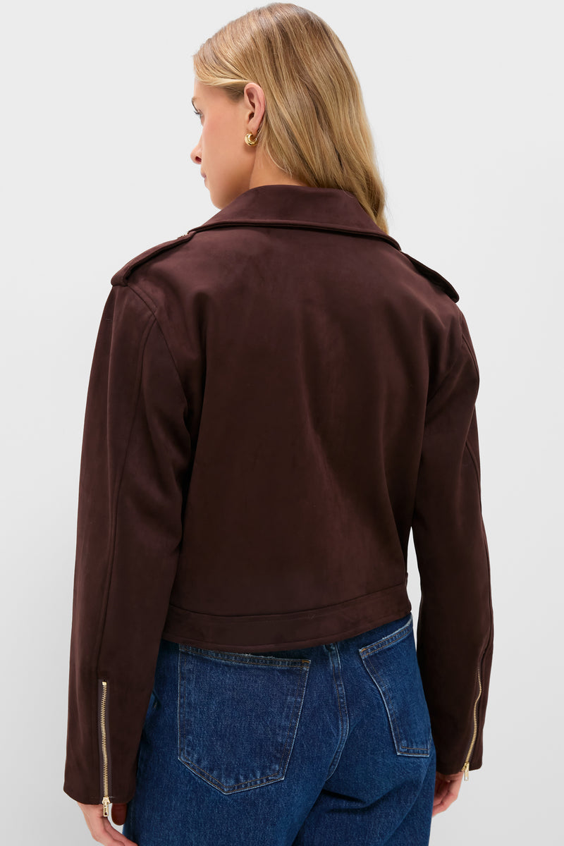 Woman wearing the Chocolate Faux Suede Bristol Jacket, showcasing a classic, effortless style with gold zipper details and chic shoulder tabs, paired with high-waisted jeans.