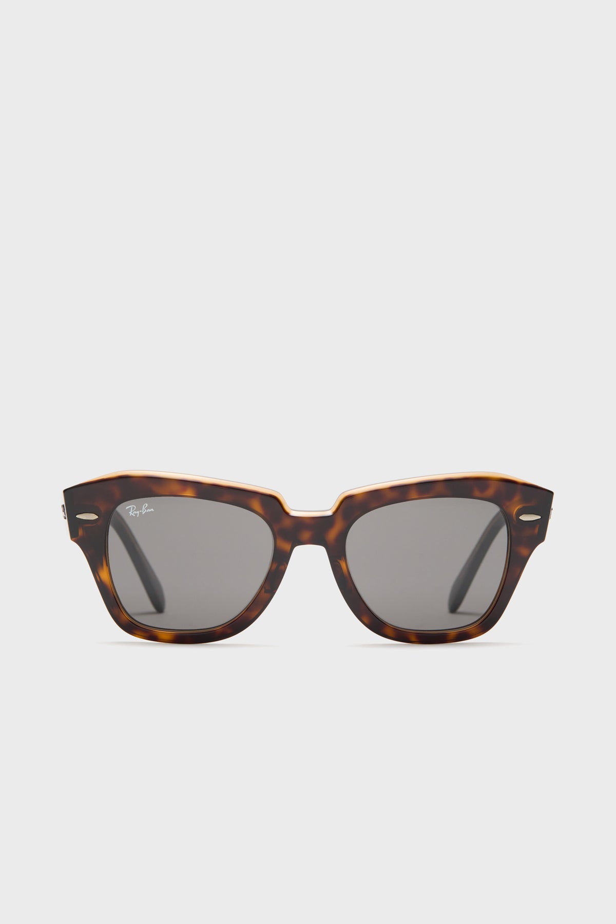 Ray-Ban tortoise shell sunglasses featuring a rectangular frame and dark lenses, inspired by the classic Wayfarer design.