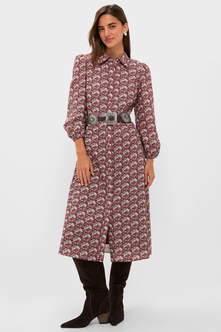 Woman in a classic Plum & Dusty Blue Leafy Floral Kai Maxi Dress, styled with a concho belt and brown knee-high boots, embodying effortless elegance and fun sophistication.