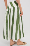 Green Stripe Nature Midi Skirt features a classic drop waist and effortless A-line silhouette, paired with woven-straw sandals for a fun, high-end look.