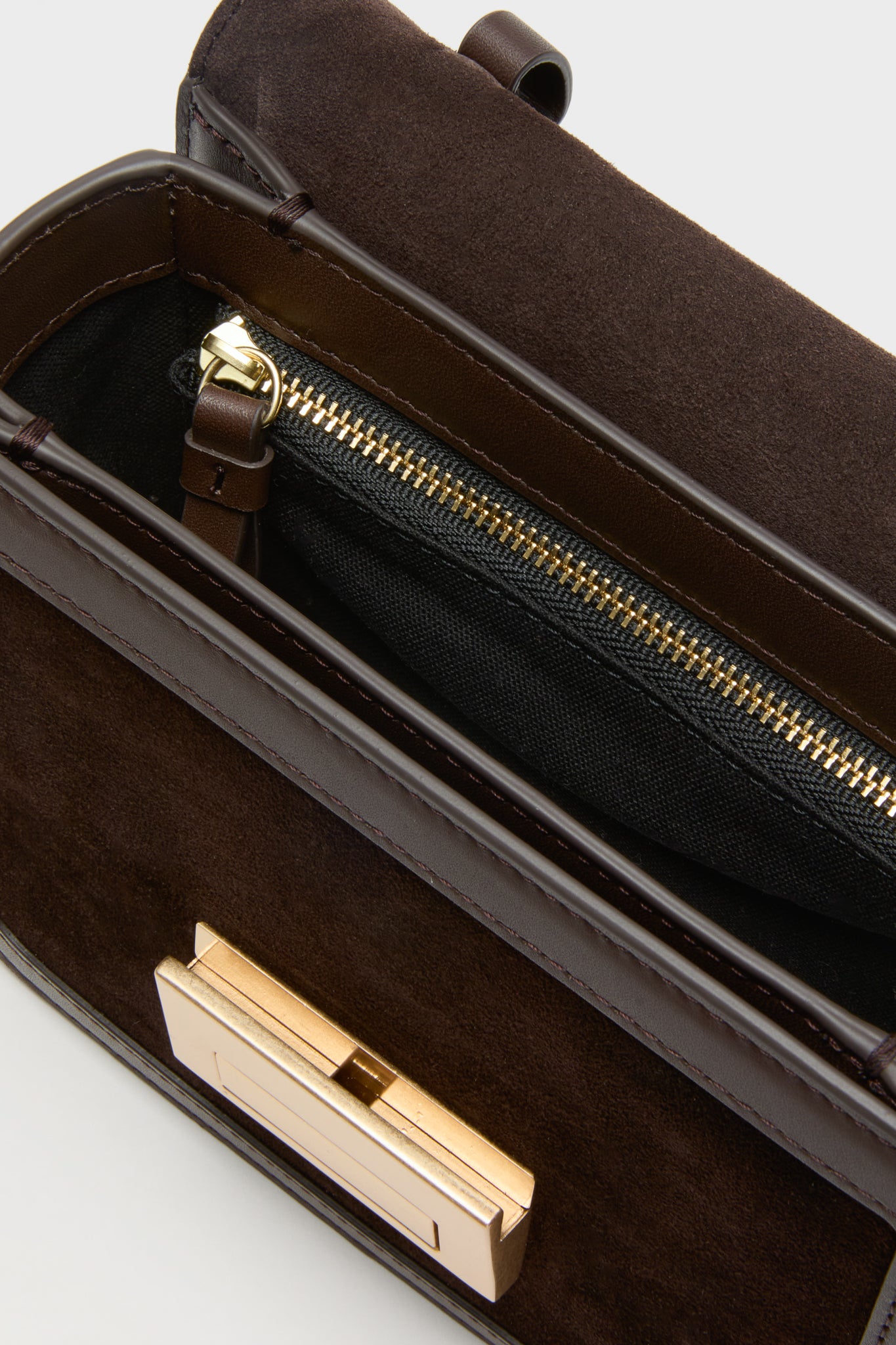 Tmoro Suede Desi Crossbody Bag: A classic, high-end handbag with effortless style, featuring rich suede, gold-tone hardware, and a practical zippered interior pocket for fun, everyday use.