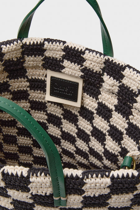 Black and Cream Crochet Checker Summer Simple Tote with a classic, effortless design, featuring green leather handles, a Clare V. patch, and a fun, high-end vibe.