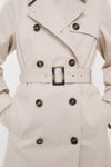Mist Short Greta Showerproof Jacket, a classic, high-end trench coat with tortoiseshell buttons, wide lapel, and belt, embodying effortless style and fun versatility.