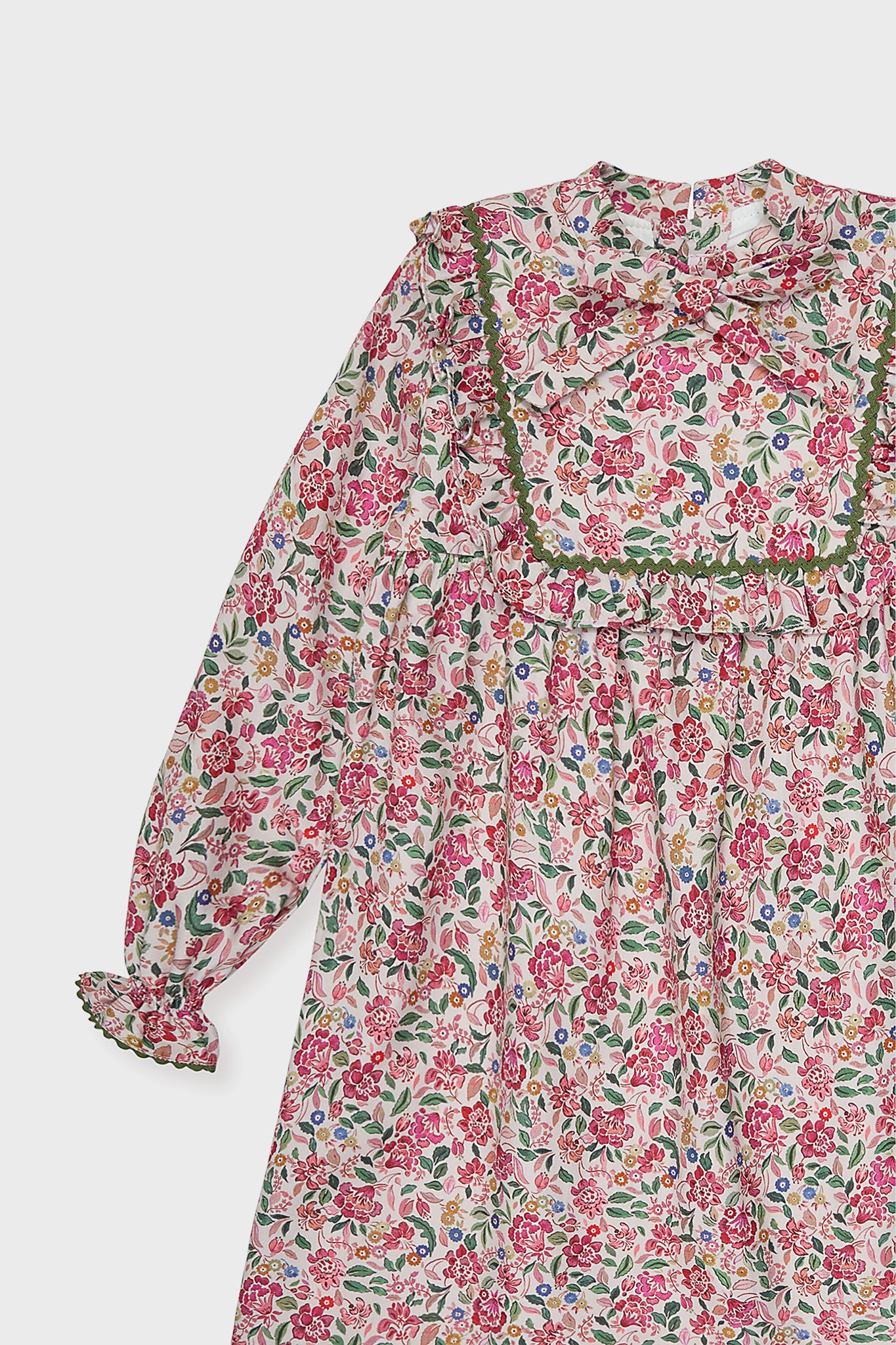 Pink Floral Laurelia Girl Empire Dress, a classic and effortless piece with floral print, ruffled yoke, bow neckline, and bishop sleeves, offering high-end fun for little ones.