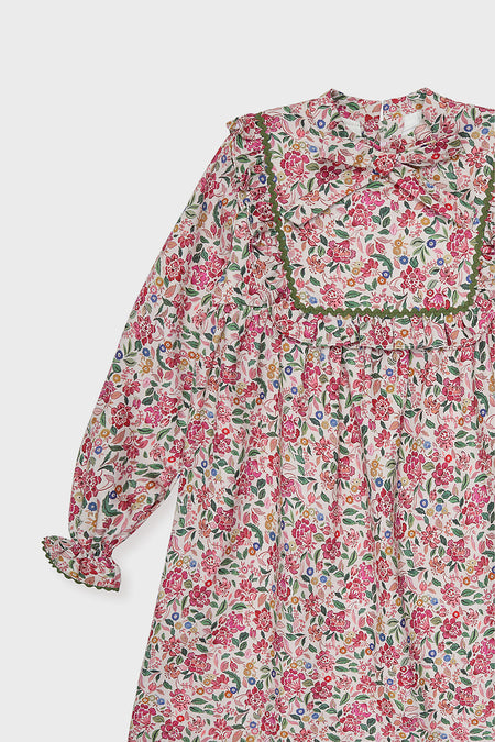 Pink Floral Laurelia Girl Empire Dress, a classic and effortless piece with floral print, ruffled yoke, bow neckline, and bishop sleeves, offering high-end fun for little ones.