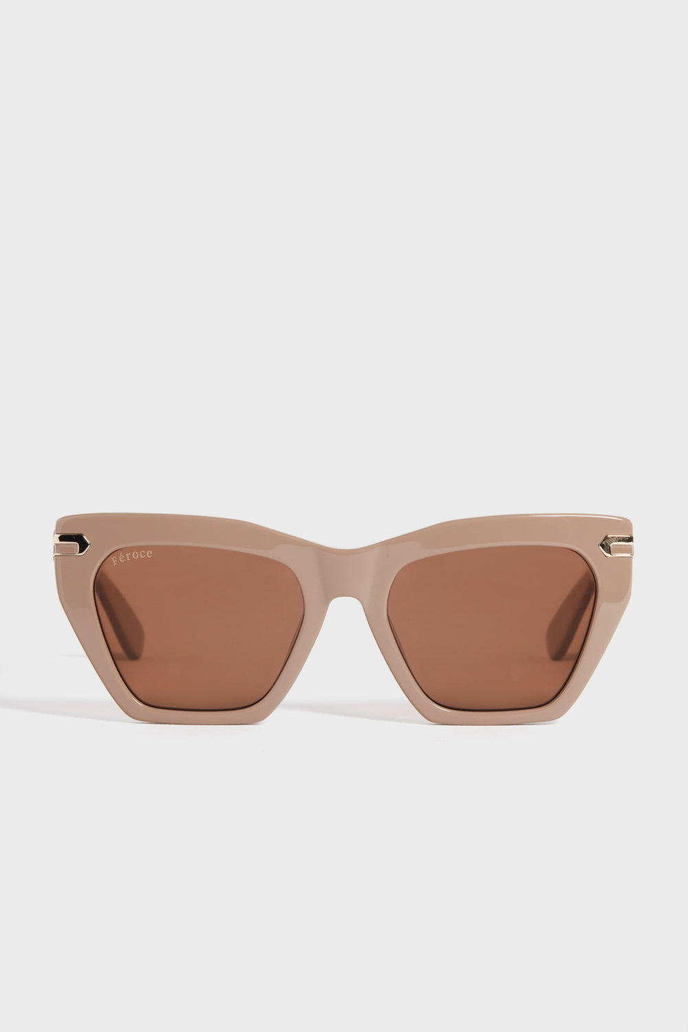 Feroce Taupe Heather Sunglasses feature elongated angular frames and brown tinted lenses for a chic, geometric look.