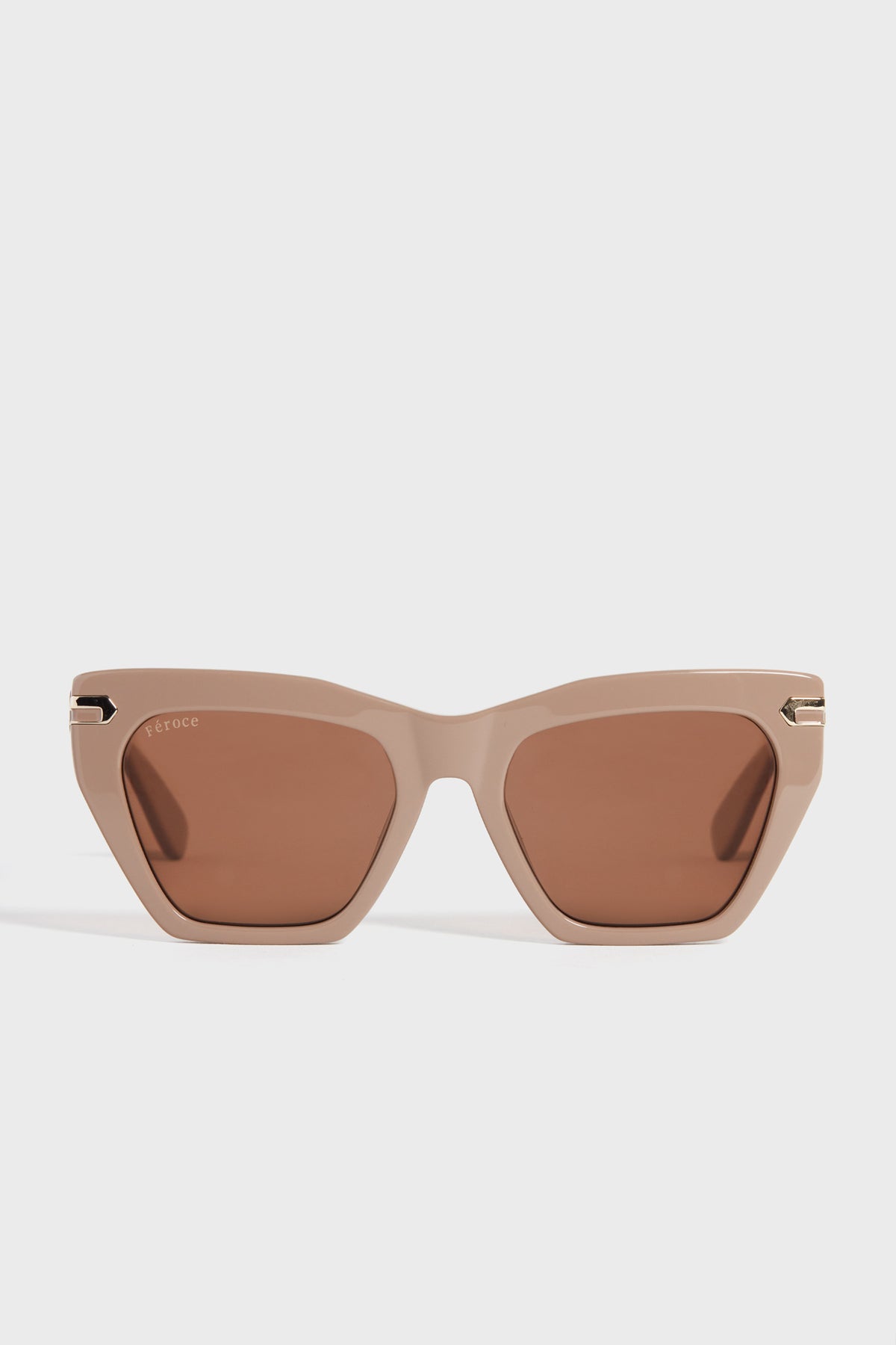 Feroce Taupe Heather Sunglasses feature elongated angular frames and brown tinted lenses for a chic, geometric look.