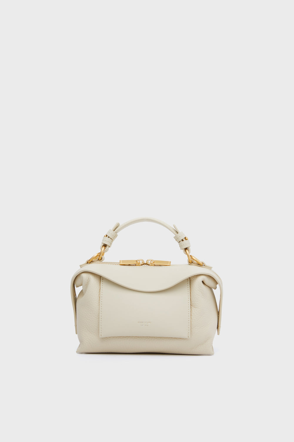 The Oroton North Sea Mica Mini Bowler is a small luxury handbag in cream, featuring a top handle, front pocket, and gold-tone hardware.
