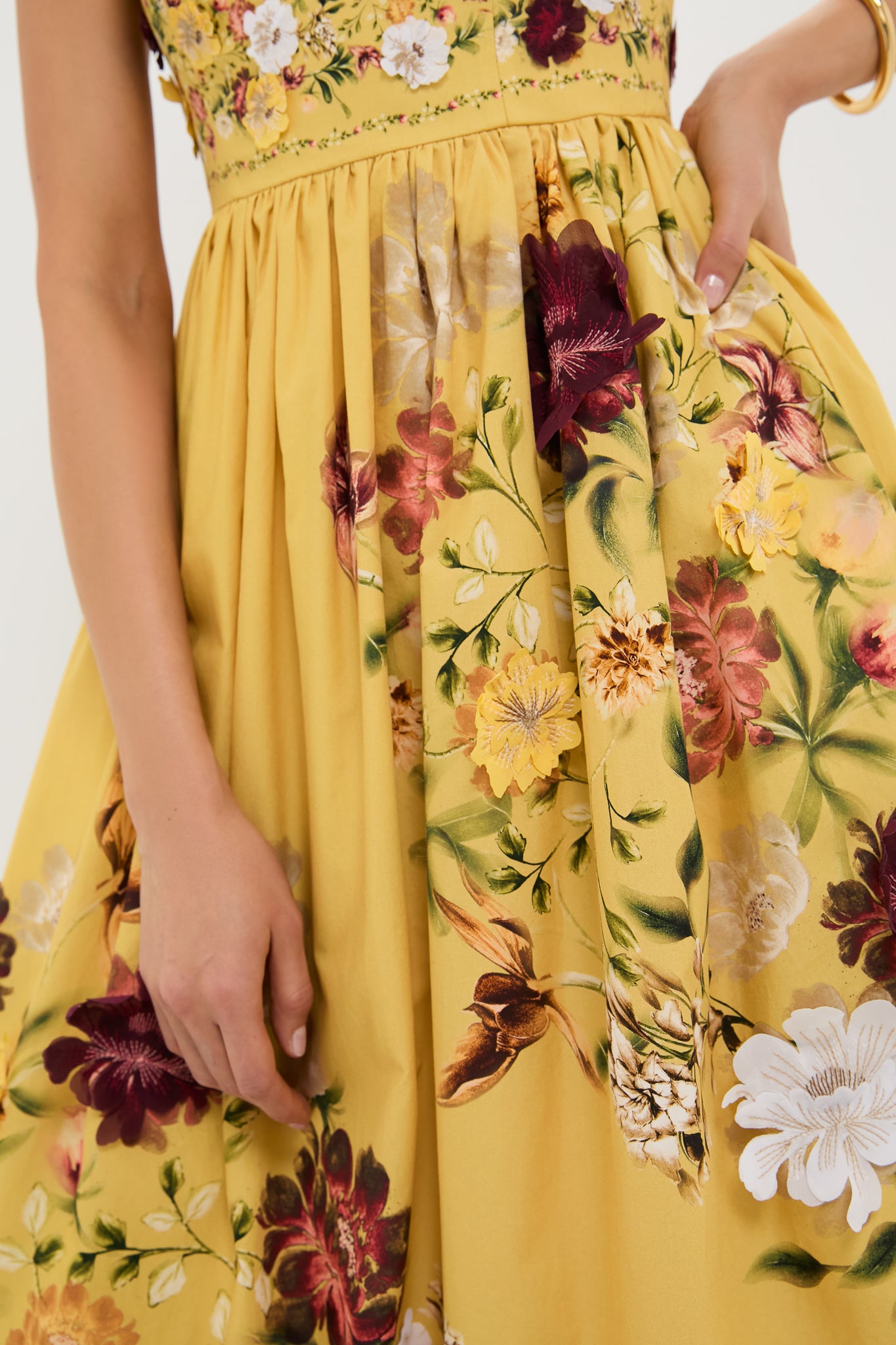 Paramo Barbara Maxi Dress features a classic, knee-length yellow sundress with an effortless full skirt, multicolored floral print, and fun hidden pockets for a high-end look.